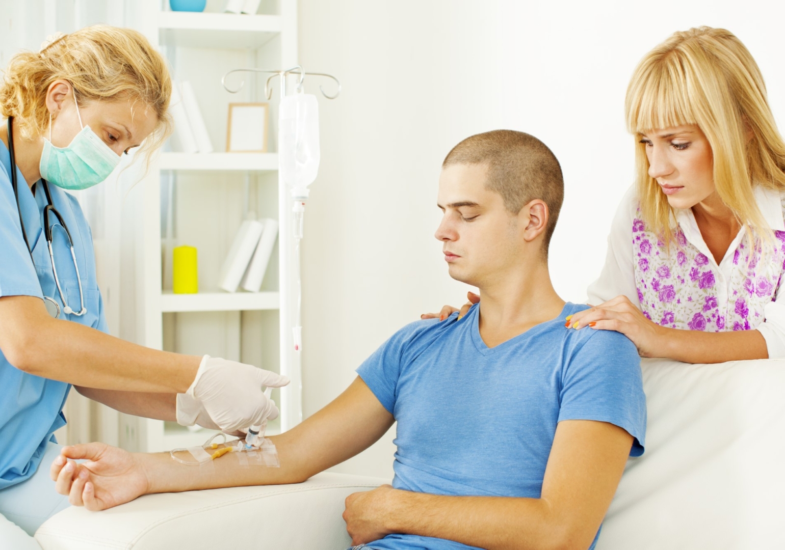 Young man receiving intravenous therapy from Rx iV