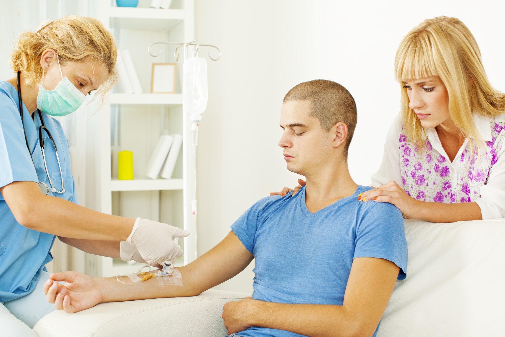 Young man receiving intravenous therapy from Rx iV